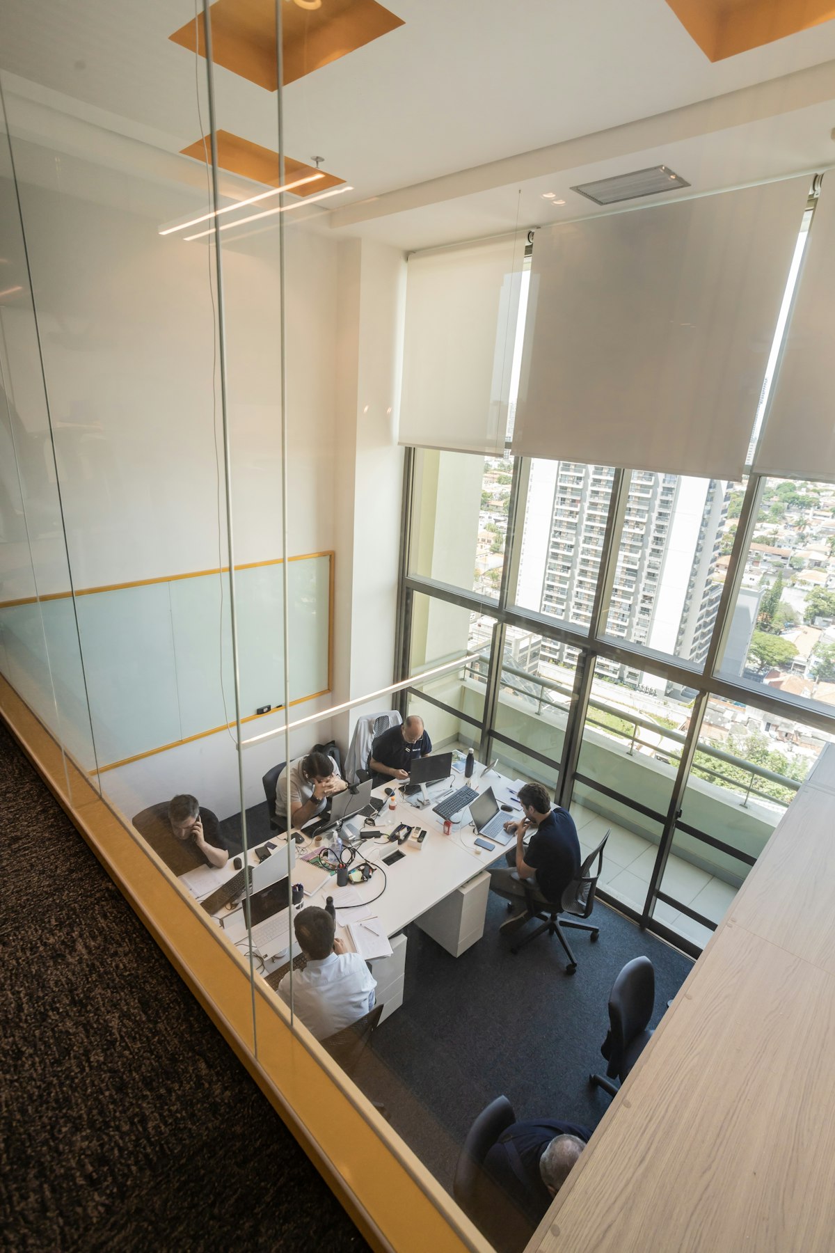 Executives meeting in a modern glass-walled office